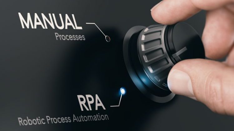 A hand touches a dial that decides whether to complete a process manually or with robotic process automation