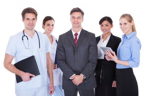 Group Of Businesspeople And Doctors