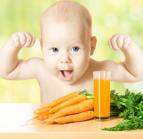Child And Fresh Carrot Juice Glass. Concept: Healthy Vegetable F