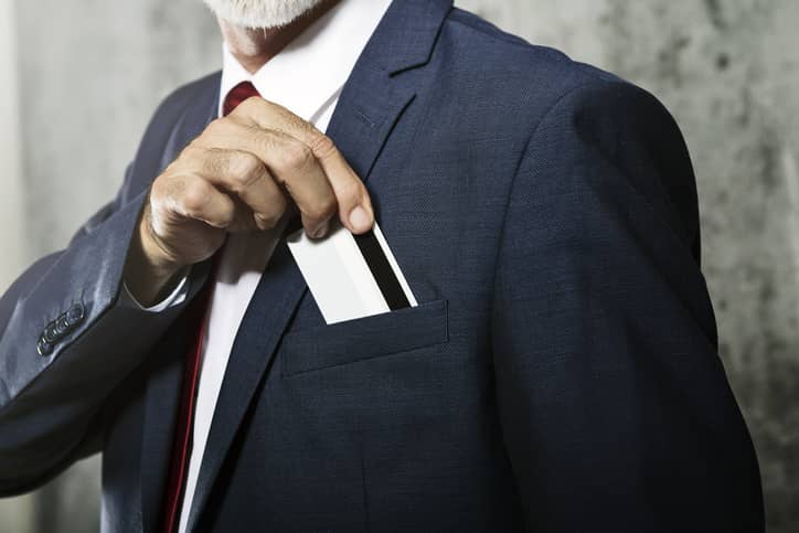 Man in a suit with security card in pocket